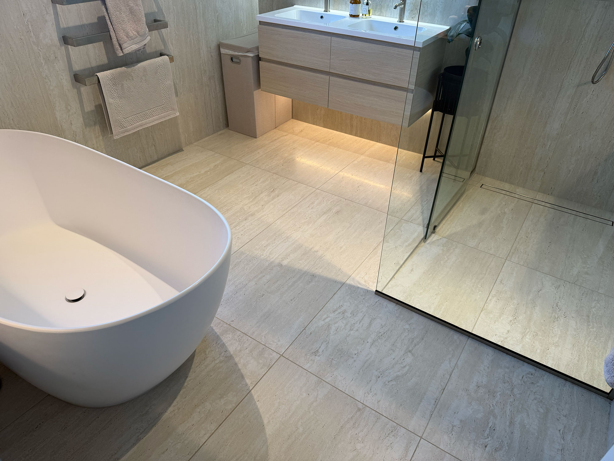 bathroom tiling with bath and shower