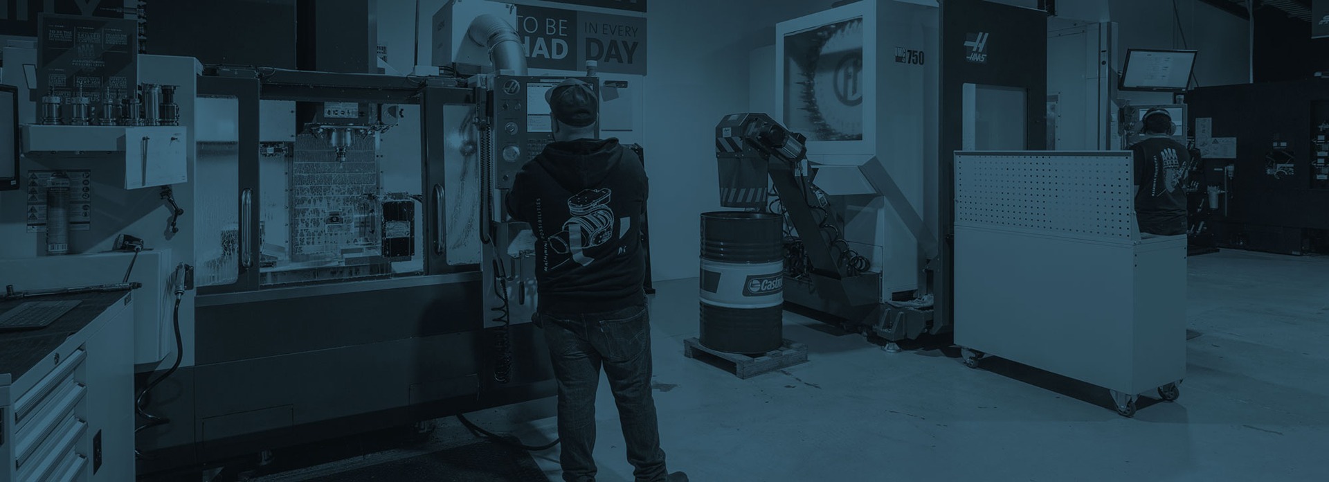 United Machinists workshop background showing CNC machinery and production equipment